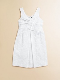 An angelic, eyelet frock with slight pleating in a crisp, clean hue is perfect for any special occasion.V-neckSleevelessHidden back zipperSlightly pleated skirtCottonMachine wash; dry flatImported