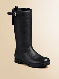 Tall boot with side buckle and inside zipper. Back pull tab Logo detail Leather Rubber sole Imported