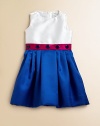 Crafted in a striking colorblock design, this cute-as-a-button frock is elegant in shiny satin with a full, pleated skirt.Jewelneck with rosette detailSleevelessBack zipperFull, pleated skirtPolyesterDry cleanMade in the USA