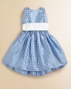 A classically preppy dress is rendered in gingham-printed silk taffeta for a perfect party ensemble.JewelneckSleeveless with slim strapsBack buttonsGather waist with solid sashFull skirt with ruffled petticoatSilk taffetaDry cleanImported Please note: Number of buttons may vary depending on size ordered. 