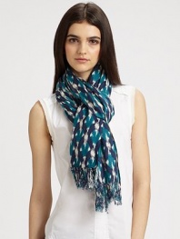 A boldly colored print with knotted fringe detail. 85% wool/15% silkAbout 27 X 71Dry cleanImported 
