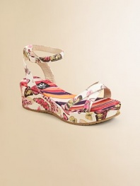 Positively brilliant, this graceful sandal combines bright butterflies and colorful stripes on a modern wedge.Polyester fabric upperCrisscross front strapsBuckle ankle strapsGoatskin leather liningStriped fabric footbedMolded fabric-covered wedgeNon-slip soleMade in Italy