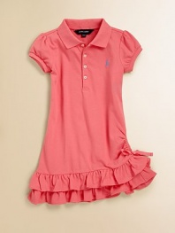 A cotton mesh polo dress teems with ruffles at the hem for a pretty update to a preppy essential.Ribbed polo collarShort capped sleevesButton frontSide ruchingTiered ruffle hem with bow detailCottonMachine washImported Please note: Number of buttons may vary depending on size ordered. 