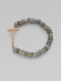 This grey moonstone beaded, stretch design is accented with a diamond embellished 14k rose gold cross on the horizontal for a modern look. Grey moonstone beads14K rose goldDiamonds, .26 tcwLength, about 6¾Elastic slip-on styleMade in USA of imported materials