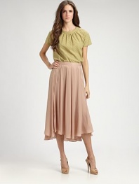 Soft variegated pleats lend shape to this airy, feminine tea-length silhouette.Self waistbandPleatedAsymmetrical hemConcealed side zipAbout 31½ from natural waistPolyesterDry cleanMade in Italy of imported fabricModel shown is 5'11 (180cm) wearing US size 4. 
