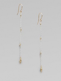 Gracefully dangling strands of sterling silver chain, sprinkled and tipped with glowing faceted beads of 14k gold.14k yellow gold and sterling silverLength, about 2¼Ear wireMade in USA