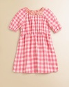 Rendered in pure cotton, this soft and sweet gingham print frock is perfect for school, play or a party.Ruched crewneck with bowShort puffed sleeves with elastic cuffsElastic waistShirttail hemCottonMachine washImported