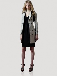 Modern colorblocking meets trench-inspired details, in this all-weather, on-trend design.Shoulder epaulettesFold-over collarDouble breasted button frontSelf beltLong sleeves with belted cuffsSide slash pocketsButton-down rainflapAbout 34 from shoulder to hemCottonDry cleanImportedOUR FIT MODEL RECOMMENDS ordering true size. 