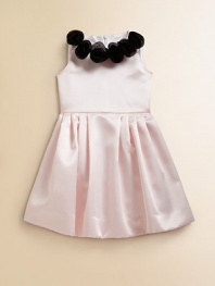 She'll be picture perfect in this frilly, satin frock embellished with delicate rosettes for a sweet ensemble.Jewelneck with rosette detailSleevelessBack zipperFull skirtPolyesterDry cleanMade in the USA