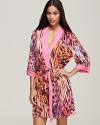 A vibrant animal print wrap with contrast pink trim, a fierce bedtime look from Josie.