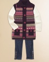 A preppy Fair Isle print adds a punch of color to an otherwise simply sweet sweater.Turtleneck open frontSleeveless Two front patch pockets with button closure Front button closureDrop-waist with pom-pom bow detail55% cotton/45% acrylicMachine washImported