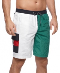 Hit the sand and surf with these all-American swim trunks from Tommy Hilfiger.