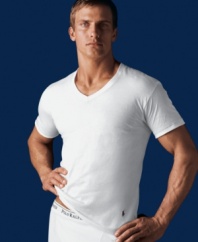 In a super comfy, soft cotton, this body-hugging tee is a great fit under clothes or even alone. Logo applique at hem.
