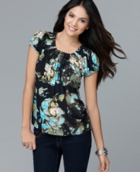 This petite floral-printed top from Style&co. features a feminine pleated neckline and pretty cap sleeves. Perfect to pair with sleek dark denim!