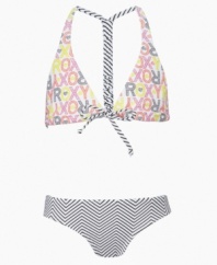 Mix it up! Print and stripes combine to make a dynamic style duo on this racerback swimsuit from Roxy.
