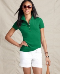 Country club style at a reasonable price - get it with this essential Tommy Hilfiger polo shirt. Choose from vibrant colors and greet springtime with panache!