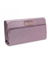 An understated design packs in true polish and sophistication for an always-smooth landing. The coordinating amethyst lining adds a lively contrast that guarantees style is always in the bag.
