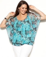 Cheer up your wardrobe for spring with INC's batwing sleeve plus size top, broadcasting a bold print!