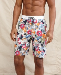 It's time to start looking on the bright side.  A floral print adds some pep to your poolside style on these swim shorts from Tommy Hilfiger.