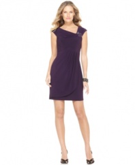 An asymmetrical neckline with a beaded, brooch-like embellishment dresses up this petite silhouette by Jessica Howard.