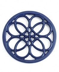 This quaint cast iron trivet, a charming piece to place on any countertop or dining table, features a classic pattern that protects virtually any surface from hot pots and pans. Limited lifetime warranty.