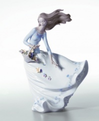 The dynamic movement of this handcrafted piece brings beauty to your home. The perfect gift or addition to your own decor, this porcelain figurine celebrates the splendor of flower petals floating in the wind. Measures 11.25 x 8.