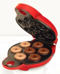 This do-it-all donut maker from Bella Cucina lets you serve up homemade mini doughnuts in no time flat (or round)! Baked instead of deep fried, these delicious treats are a healthier choice whenever you crave something sweet. One-year limited warranty. Model 13466.
