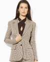 Rendered in a sleek two-button silhouette, the Sullivan jacket is crafted in chic pinstriped wool for a polished look.