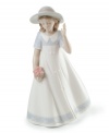 Picking posies. A young girl welcomes spring in a lovely white dress, presenting an image of freshness and youth in this darling porcelain figurine from Lladró.