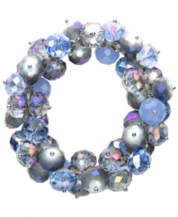 Cool off with a stylish splash of color. c.A.K.e. by Ali Khan's shimmery cluster bracelet features crystal beads (10 mm and 12 mm) in a gradation of blue hues. Bracelet stretches to fit wrist. Approximate diameter: 2-1/4 inches.