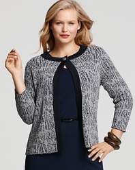 Infuse your look with uptown polish in this Jones New York Collection cardigan, crafted in a textured bouclé knit with solid ribbed trim. Complete the refined look with a chic pencil skirt and a string of pearls.