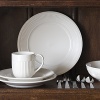 Edme saucer by Wedgwood. Wedgwood marks the 100th anniversary of its classic Edme collection with a refreshing update of its timeless pattern. A new antique white glaze enhances the elegant colannade embossment and laurel motif accent pieces. Sophisticated shapes and generously sized pieces make this pattern ideal for today's lifestyle.