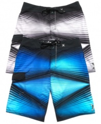 Get graphic. Whether you're hitting the beach or the streets, these Hurley board shorts turn the volume up on your sweet surfer style.