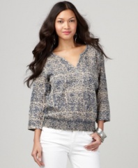 Lucky Brand Jeans romanticizes the peasant top with an inky floral print and a smattering of tiny sequins at the neckline. Add a pair of dangly earrings and your favorite denim for a flawless casual look.
