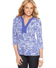 Charter Club outfits this three-quarter sleeve top with a bright fern and floral print and a contrasting solid trim at the neckline.