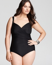 Rise above the trends with this classic one piece from Miraclesuit. The crossover ruched front and side gathers conceal and contour without compromising comfort.