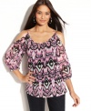 Show off a little shoulder in INC's striking petite top--a bold print and sexy silhouette make it a stunner.