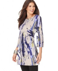 This petite tunic by Alfani features a vibrant painterly print on a flattering tunic silhouette. Pair with your favorite leggings for an effortlessly stylish look. (Clearance)
