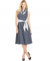 Jones New York Signature outfits this classic A-line with an extra feminine touch--a ruffled neckline and self-tie belt in a contrasting polka dot print.