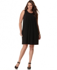 Pretty pleats define this easy-fitting and flattering plus size shift dress by Calvin Klein.