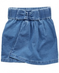 Denim darling. This easy-to-match Guess skirt has a bow to sweeten up a classic style.