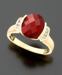 Bold and beautiful. An oval-cut garnet (3-1/2 ct. t.w.) held dear to her heart with round-cut diamonds (1/8 ct. t.w.) at the sides, all set in 14k gold.