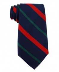 Tommy Hilfiger elevates a sporty look to a sophisticated new standard with this striped silk tie.