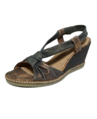 Get back to your roots. Distressed fabric lends an earthy vibe to the wear-everywhere Pola wedges by Donald J Pliner.