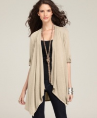 A swingy cardigan gets a new look from Style&co. The elbow-length sleeves look chic with button-closure roll tabs!