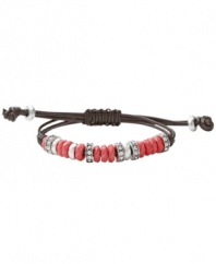 Spruce up your summer look in Fossil's bright bracelet. Strung from a brown leather cord, reconstituted jade beads in dyed watermelon combine with sparkling crystals for a lively look. Set in silver tone mixed metal. Bracelet adjusts to fit wrist. Approximate diameter: 2-1/2 inches.