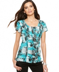 Alfani's petite printed top features a bold abstract design and flattering ruching at the center. Wear to work with sleek pants and your favorite heels!