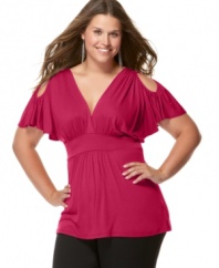 The cold shoulder has never been so hot: Soprano's beautifully-draped plus size top features a sexy peek of shoulder and a flattering empire-waist silhouette.