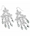 Flirty and fabulous, GUESS's four flower chandelier earrings shine with the addition of sparkling crystals and mirror beads. Set in silver tone mixed metal. Approximate drop: 3 inches. Approximate width: 1-3/4 inches.