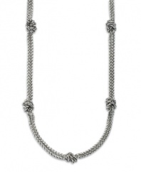 A classic necklace by Lauren by Ralph Lauren featuring two silvertone mixed metal rope chains with knots interspersed. Approximate length: 36 inches.